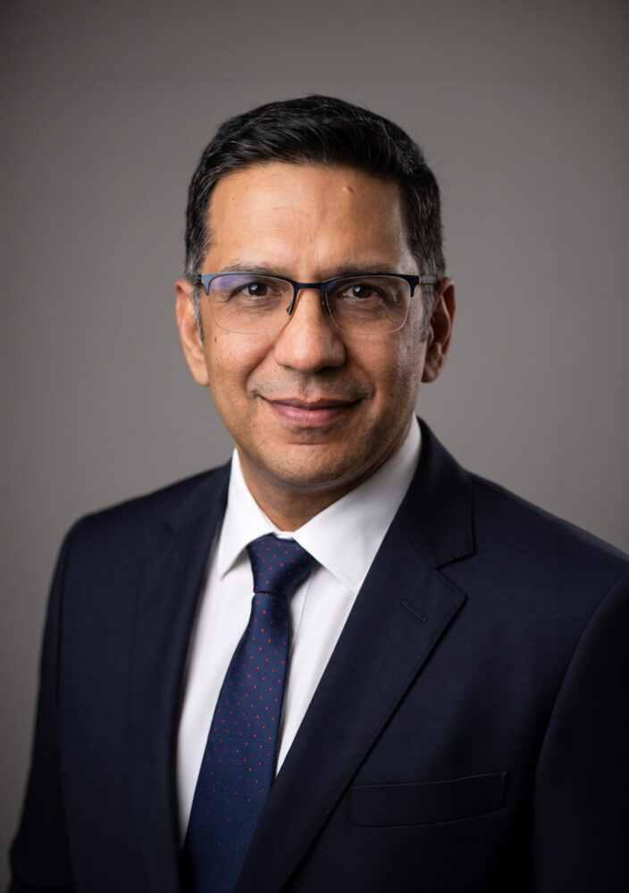 Professor Rohit Rambani Consultant Orethopaedic Hip & Knee surgeon at HMT St Hugh's Hospital in Grimsby professional headshot